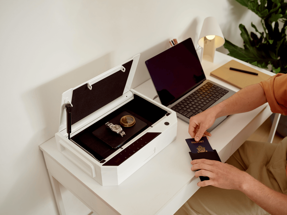 Case Safe on Desk with Hand Holding Passport Holder