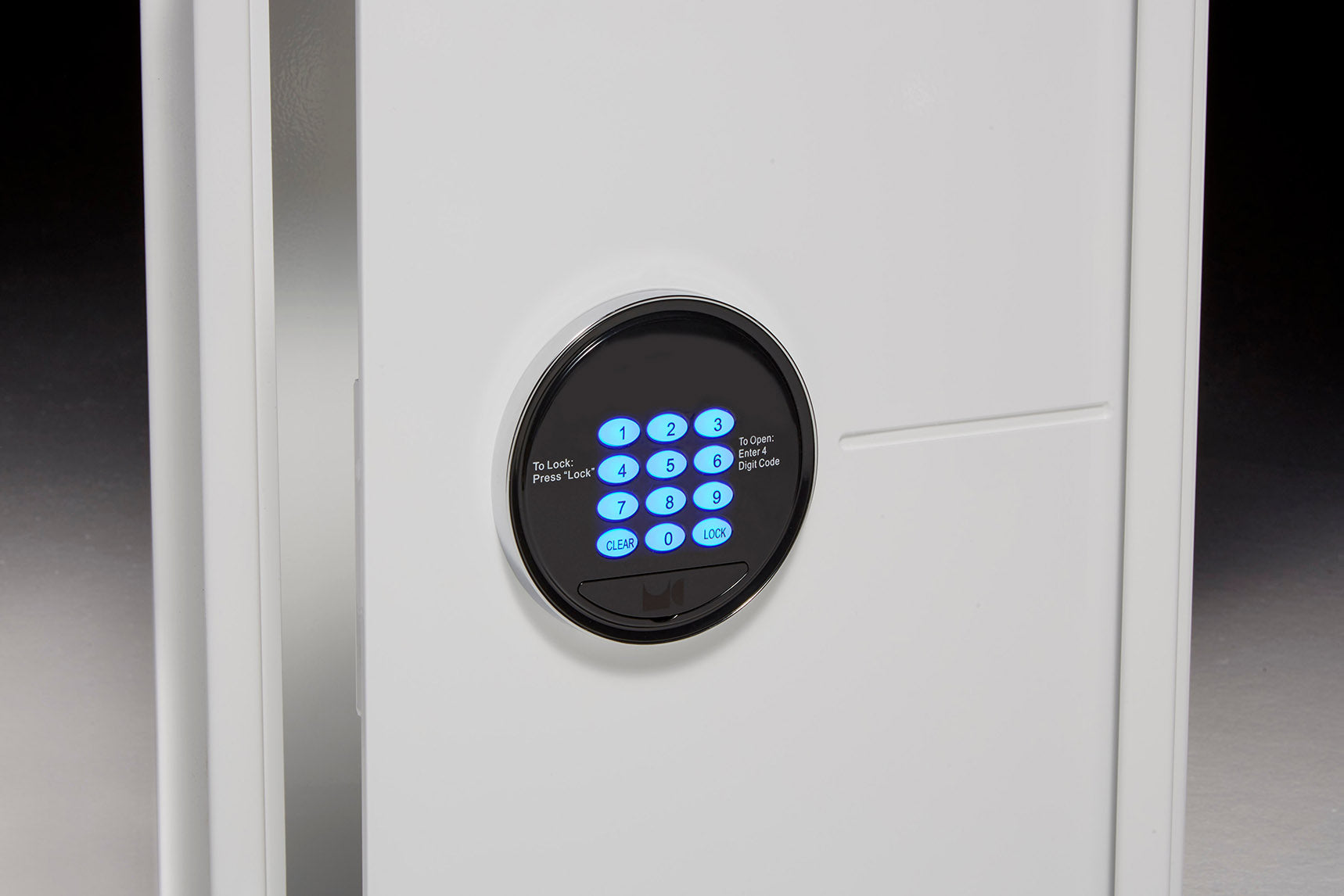 White wall safe with lit up keypad buttons